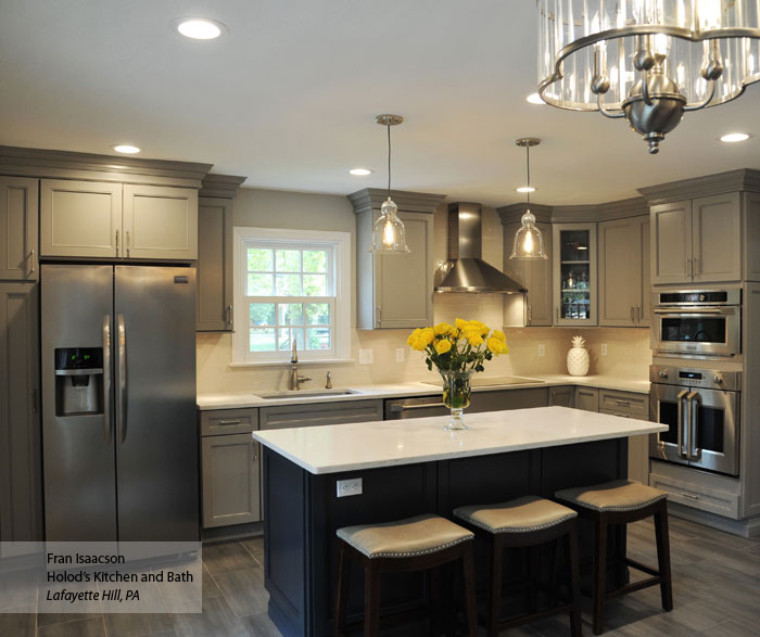 Gray cabinets with a dark blue kitchen island