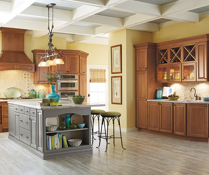 Cherry cabinets with a gray kitchen island